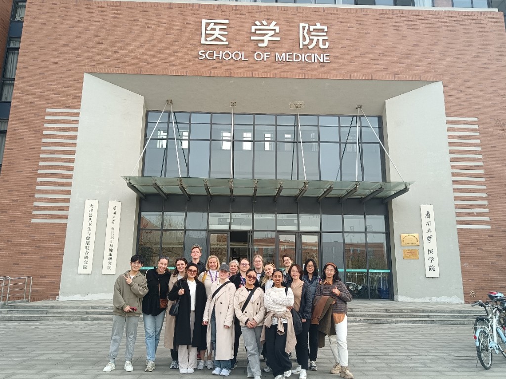 Students and faculty in front of the School of Medicine building at Nankai University.